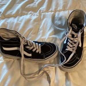 Black and white vans high top sneakers